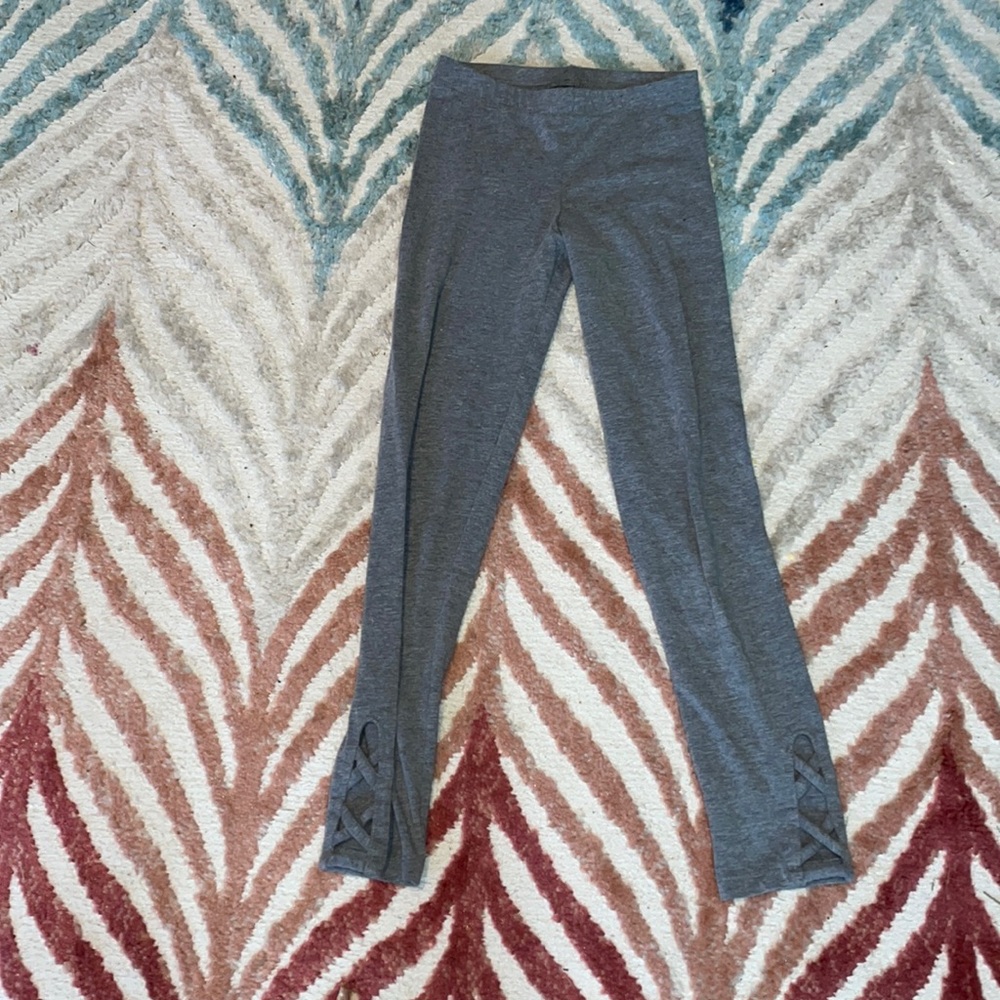 Gray leggings with fancy holes at bottom size medium :8